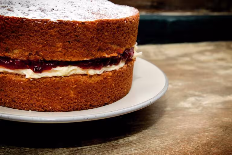 A classic, uncut Victoria sponge with a deep filling of butter cream and jam